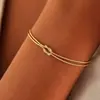 Europeo y Americano Nuevo Nudo Hueso de Serpiente Latón Nudo de Amor Amor Ilimitado Pulsera de Pareja Adornos de Mano de Amor Ilimitado