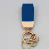 Marca de moda patrón de cordero llavero corto llavero cabeza de rábano llavero de regalo pequeño llavero de cuero charm simple para bolso