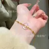 Venta al por mayor de fábrica pulsera de jade de espuma de agua natural roja de departamento pequeño diseño de rosquilla plata s925 incrustada nuevo diseño chino de lujo ligero