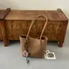 Bolsa casual estilosa de grande capacidade 2026 novo modelo bolsa de ombro casual bolsa de axila padrão trançado bolsa sacola para o dia a dia
