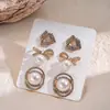 Pendientes Transfronterizos Europeos y Americanos con Piedra Ojo de Gato Plateada, Perla y Lazo en Forma de Corazón, Pendientes de Moda Estilo Commuter para Mujer