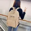 Mochila de Gran Capacidad Transfronteriza 2024 Nueva Simple Letra Mochila Escolar para Estudiante de Secundaria Mochila de Viaje Ligera de Moda
