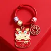 Dragón lindo año del dragón metal dragón etiqueta pequeña colgante Año Nuevo llavero de coche accesorios para bolso regalo pequeño para pareja venta al por mayor