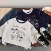 Camiseta de algodón puro para niños, modelo primavera y otoño 2026 para bebés y niños pequeños, top de dibujos animados graffiti estilo ins, camiseta interior de manga larga para niños