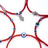 Venta caliente transfronteriza Nuevo Palma dos cuentas redondas ojos azules mal de ojo pulsera tejida con cuerda roja ajustable venta al por mayor de fábrica