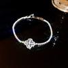 Pulsera de flor de circón con incrustaciones de diamantes de alta calidad, ultra brillante, estilo pequeño y fresco, adornos de mano de lujo ligero, estilo frío, venta al por mayor para mujeres