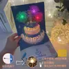 Tarjeta de felicitación de cumpleaños tridimensional creativa DIY de alto nivel tallado en papel hecho a mano regalo bendición música fuegos artificiales luminosos tarjeta