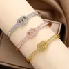 Moda Estilo Coreano Pulsera Cruzada de Doble Círculo de Lujo Ligero Inspirada en Chanel para Mujer, Pulsera Elegante y con Estilo de Aleación al por Mayor