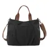 Bolsa de lona estilo casual para mujer, bolsa tote de moda de gran capacidad, versátil para el trabajo, de un solo hombro y cruzada, nuevo modelo 2026