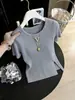 Blusa de tricô de seda gelada de manga curta para mulheres 2026 Primavera/Verão estilo fino gola redonda camiseta top solto que rejuvenesce