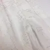 Nuevo tejido de gasa con rayas en relieve dorado y líneas geométricas, adecuado para decoraciones de bodas, cortinas, accesorios y materiales de confección.