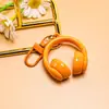 Nuevo llavero creativo de auriculares 3D, un accesorio moderno y genial para bolsos, joyería hecha a mano para manualidades y materiales para accesorios, al por mayor
