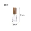 Al por mayor en stock Múltiples especificaciones y estilos Botella dispensadora de perfume simple y portátil Botella rociadora Botella dispensadora cosmética Tapa de madera