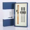 Traje de regalo de sándalo creativo cultural pluma de firma caja de regalo con tallado conmemorativo logo del traje pluma de gel de latón para negocios en stock