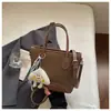 Bolsa de mão de moda transfronteiriça bolsa pequena nova feminina de alto valor super popular bolsa sacola balde pequena bolsa tote pequena simples de ombro único transversal bolsa de ombro a tiracolo moderna