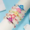 Directo de fábrica moda pequeña fresca flor de arcilla blanda concha pulsera tejida femenina joker cuerda de mano tejida a mano venta al por mayor