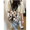 Mochila de Lona con Lunares de Nicho Transfronteriza para Mujer 2026 Nueva Mochila Grande de Gran Capacidad para Viajes Diarios Múltiples Bolsillos Mochila Escolar para Estudiantes