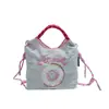 Bolsa Donut de Nylon Bordada Estilo Japonês Ins 2025 Nova Moda Mini Bolsa para Deslocamento Ombro Único Transversal Bolsa Pequena