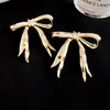 Pendientes de Aro con Lazo de Cinta Transfronterizos Europeos y Americanos para Mujer, Estilo Elegante y Sencillo, Pendientes de Moda con un Toque de Alta Gama, Pendientes Adelgazantes para Mujer