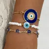 Set de pulseras de aleación multicapa transfronterizas europeas y americanas, con un diseño moderno y sofisticado con mariposas de esmalte y gemas incrustadas de diamantes