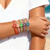 Pulsera Ajustable de Cuerda Tejida con Cuentas Redondas de Cerámica Suave Plumeria Estilo Bohemio Versátil Hawaiano Transfronterizo Europeo y Americano
