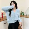 Suéter suave de alta gama para principios de otoño para mujer, impermeable de terciopelo de visón con lazo estilo dulce, cárdigan único estilo coreano con botones de perla