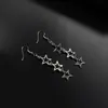 Pendientes largos de estrella de cinco puntas hueca transfronterizos de plata para mujer, pendientes simples y elegantes de aleación de estrella, pendientes de estrella de estilo frío