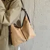 Bolsa saco casual de grande capacidade para mulheres, novo modelo 2026, bolsa tote de camurça simples e elegante, bolsa transversal para o dia a dia