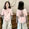 Camiseta de manga larga para niña, nuevo modelo primavera y otoño 2026, algodón puro, para niños mayores, top de otoño de imitación de dos piezas para niñas pequeñas