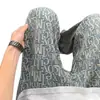 Jeans retro de estilo americano con estampado completo de jacquard de letras para hombre, populares pantalones largos de moda para jóvenes de primavera y otoño para hombre