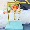 Vietnam oro cobre oro chapado Zorro amor gancho de oreja boutique imitación oro borla gancho de oreja suministro de joyería para mujer al por mayor