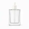Botella de muestra de producto para el cuidado de la piel con esencia de aceite esencial cuadrada plana botella vacía 100 ml alta transparencia vidrio sin plomo frasco gotero dispensador