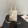 Mini bolso cubeta de lunares estilo coreano para mujer, nuevo modelo 2026, bolso de mano dulce y femenino, bolso cruzado para teléfono versátil de nicho