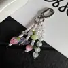 Nuevo colgante de mariposa y tulipán con cuentas ins, diseño creativo, funda para auriculares, llavero, accesorio para bolso