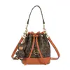 Bolsas de Diseño de Nicho Transfronterizas para Mujer Estilo Nuevo 2026 Bolso Cubo con Cordón de Monograma Bolso Cruzado de Hombro Único de Alta Gama para Mujer