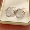 Pendientes geométricos retorcidos con gotas de aceite de aguja de plata, diseño de moda europea y americana, pendientes con personalidad de temperamento de celebridad de Internet, nuevos pendientes para mujer