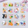 Calcomanías de dibujos animados 3D estéreo hechas a mano DIY accesorios de joyería pegamento crema resina pequeños accesorios agujero hebilla de zapato paquete de material