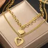 Collar de Cadena Metálica de Acero de Titanio Multicapa Hueco con Colgante de Corazón, Moda Retro Transfronteriza Europea y Americana de Gama Alta, Sencillo, Textura Metálica