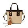 Bolso pequeño de moda y con estilo para mujer, nuevo bolso tipo cubo vintage con alto atractivo estético, bolso cruzado de un solo hombro de nicho, moderno