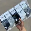 Calcetines para Mujer en Otoño e Invierno Estilo Nuevo Calcetines Deportivos Medianos-Altos para Mujer Calcetines Pequeños Frescos de Moda Color Café Tendencia Ins Fabricante Venta al por Mayor