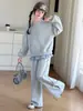 Conjunto deportivo estilo coreano para niñas, nuevo modelo otoño 2026 para niños mayores, conjunto de dos piezas con sudadera de imitación de dos piezas y pantalones de chándal con lazo