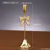 Portavelas Decorativo Dorado de Hierro con Forma de Lazo Restaurante Decoración de Boda Soporte Accesorios para Fotografía Adornos de Atmósfera para el Hogar