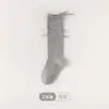 Nuevos Calcetines Infantiles de Primavera y Otoño Calcetines Esponjosos con Volantes ins Juveniles Modernos de Algodón Color Sólido Lazo de Cinta Ondulante Calcetines hasta la Pantorrilla