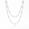 Estilo europeo temperamento diseño sentido cadena de hueso de serpiente sensación lujo ligero colgante verde esmeralda titanio acero collar mujeres conjunto apilable