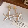 Pendientes de gota de aceite de aguja de plata con forma de estrella de mar Estilo festivo Personalidad Retro Europea y Americana Temperamento Pendientes de botón Lujo ligero Sensación de alta gama Adornos para las orejas