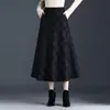 Falda de lana a cuadros de longitud media a la moda para mujer, otoño 2026 nueva de cintura alta, línea A, que cubre la cadera, fluida, moderna