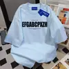 Camiseta Feminina de Manga Curta com Estampa de Letras da Marca Americana Ins Tendência Verão 2025 Casual Solta Moda Versátil Gola Redonda