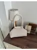 Bolsa de Axila de Moda Transfronteiriça para Mulheres, Nova Bolsa Elegante de Concha Listrada Plissada, Bolsa de Ombro de Alto Valor para o Dia a Dia