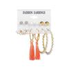 Pendientes de aleación con perlas, nueve pares, elegantes pendientes de borlas apiladas, con personalidad transfronteriza europea y americana de Amazon para verano.