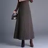 Saia feminina clássica de sarja estilosa, nova saia A-line de cintura alta que cobre o quadril para outono e inverno de 2026, saia elegante e versátil de barra larga